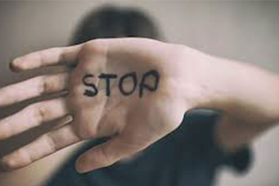 Hand with stop written